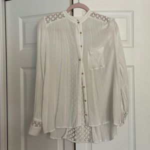 Free people white button down with see thru back and arm detailing. Size S